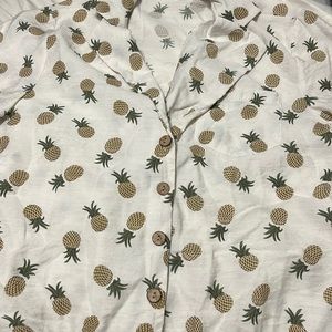 Pineapple buttoned shirt.